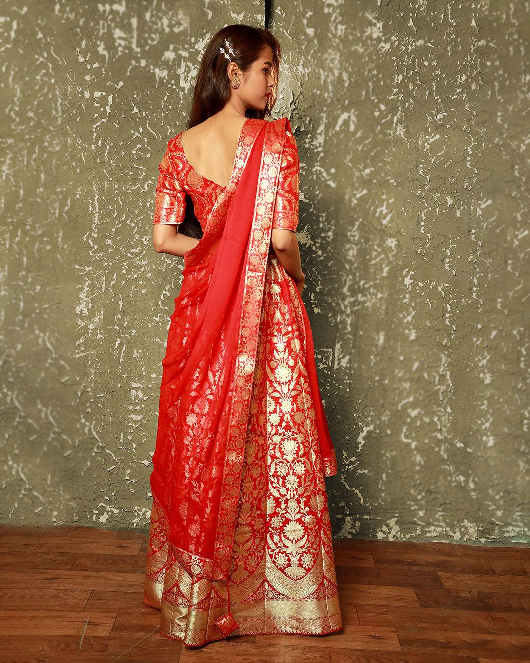 Red lehenga matched with gold embroidered blouse on Kalki
